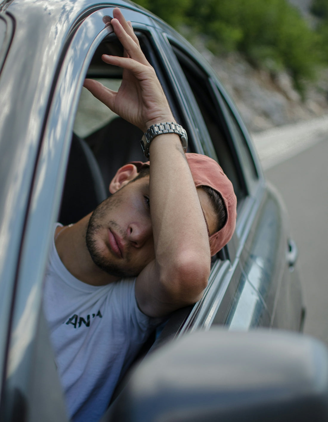 man sitting inside car