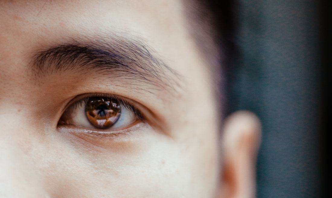 selective focus photography of left human eye