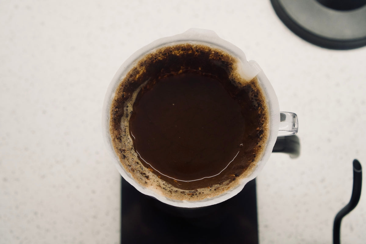 a cup of coffee sitting on top of a counter